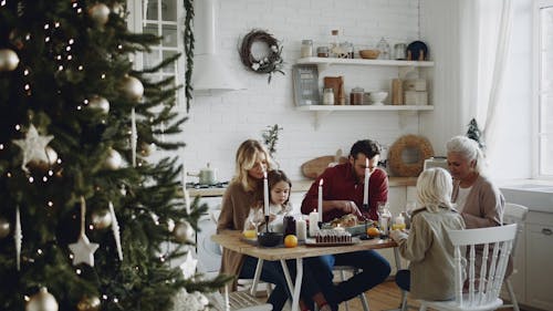 Family Eating Together At Christmas Day