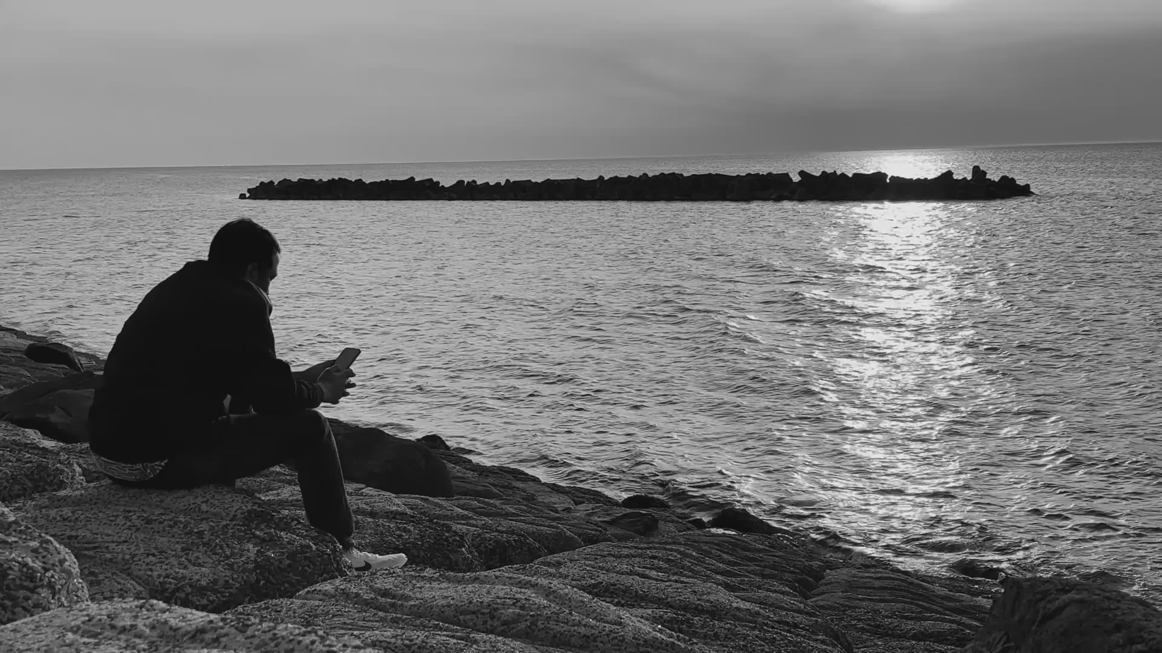 Solitude by the Sea: Man Reflecting at Sunset Free Stock Video Footage ...