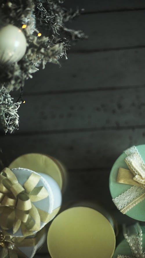 Gift Boxes Placed  Near A Christmas Tree