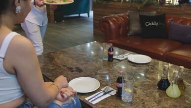 casual dining with pizza served in restaurant