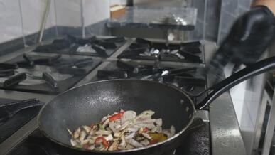 fiery cooking in professional kitchen