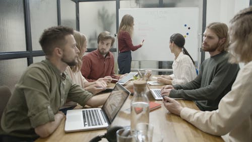 People In A Business Meeting Shares Information And Data With One Another