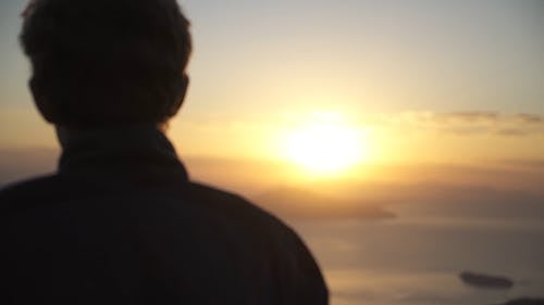 Silhouette Of A Person Looking At The Sun