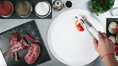 plating presentation of grilled steak with mixed vegetables