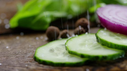 Sprinkle Of Rock Salt On Sliced Vegetables