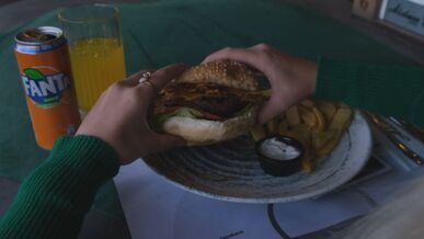 appetizing burger with fries and soda