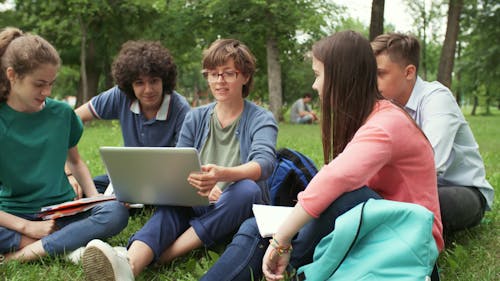 A Group Of Young People In Discussion Of A Group Project