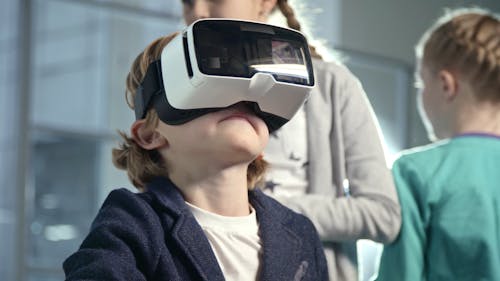 A Boy Wears A Virtual Reality Headset