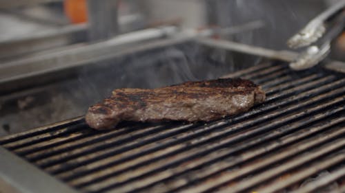 Charcoal Grilling A Piece Of Steak