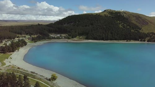 Lake Shore Of A Big Lake In Between Mountains