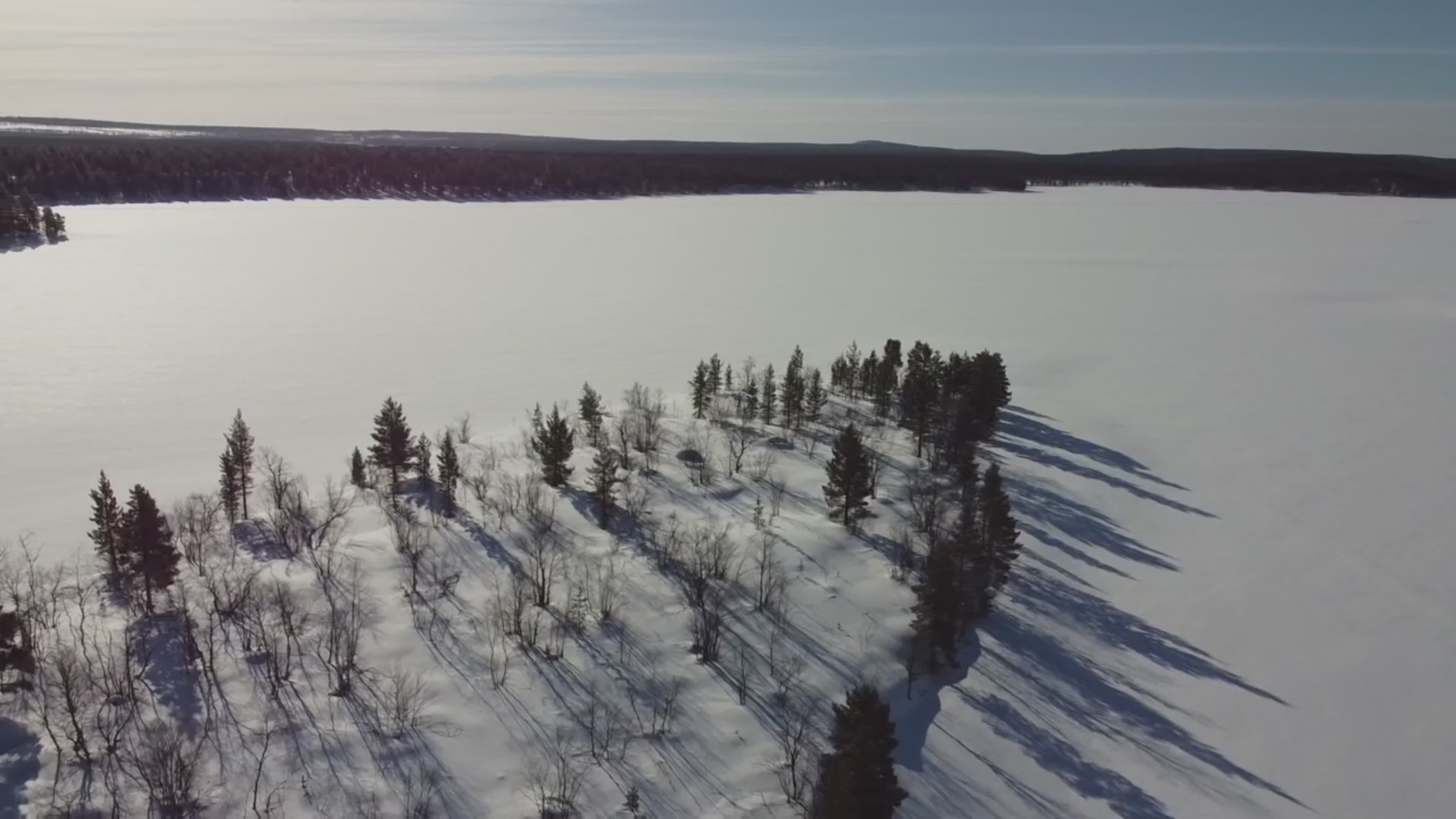 Aerial View of Snow-Covered Frozen Lake in Winter Free Stock Video ...