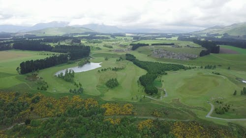 A Golf Course Built On A Large Open Grassland