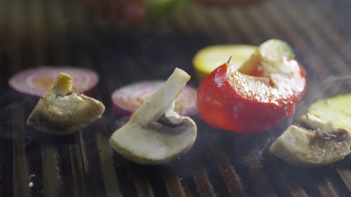 Grilling Sliced Mixed Vegetables On A Pan Grill