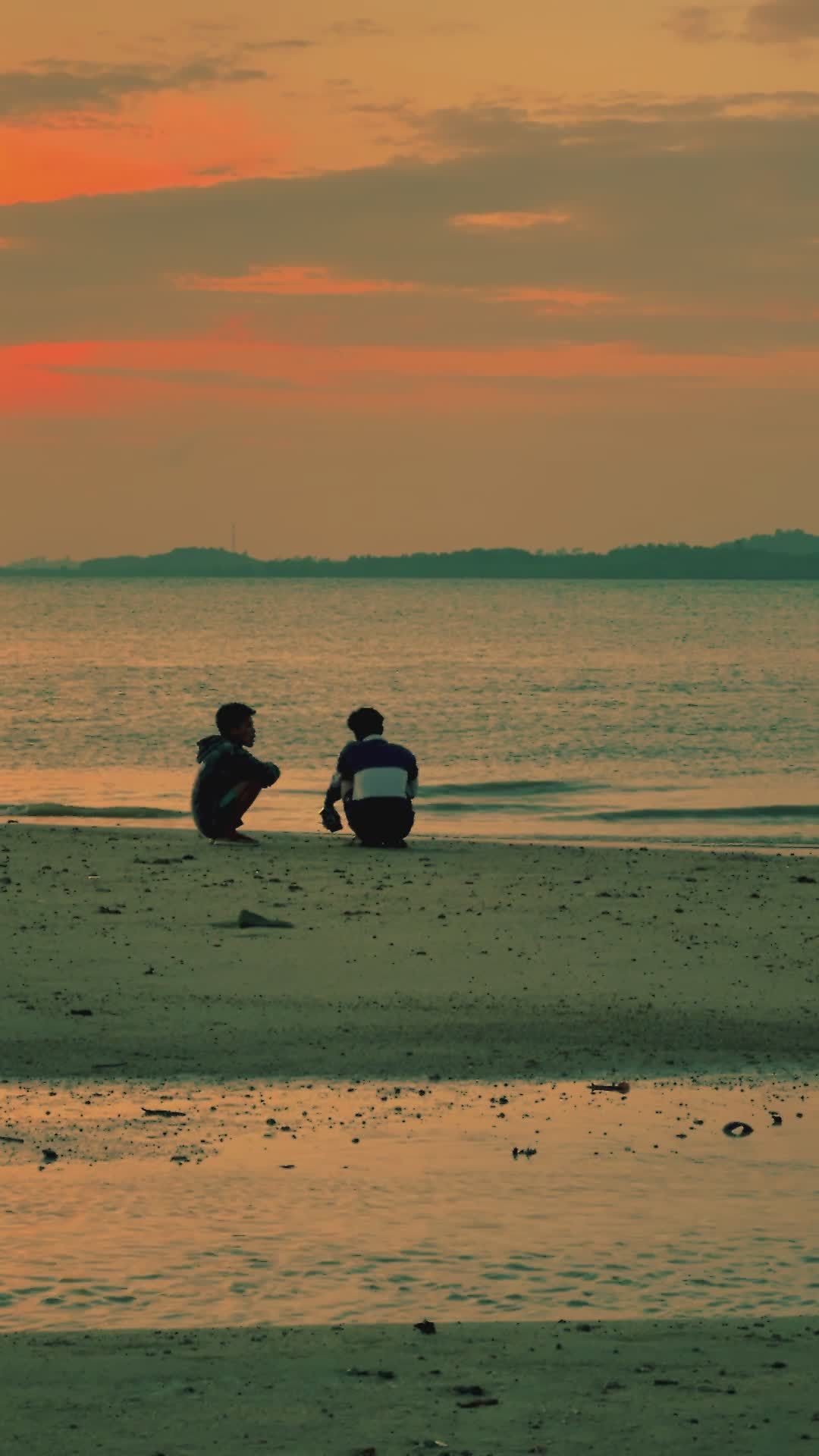 Serene Beach Sunset with Seated Silhouettes Free Stock Video Footage ...