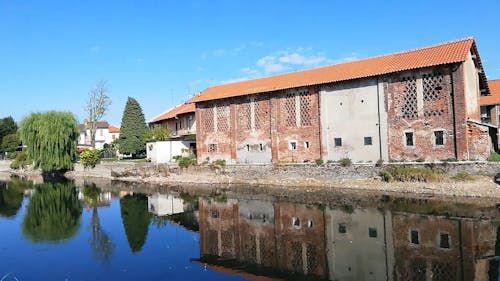 A Canal With Reflection Of An Old Building