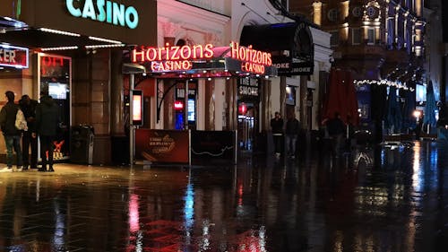 People Walking And Standing By In Front Of A Casino In London