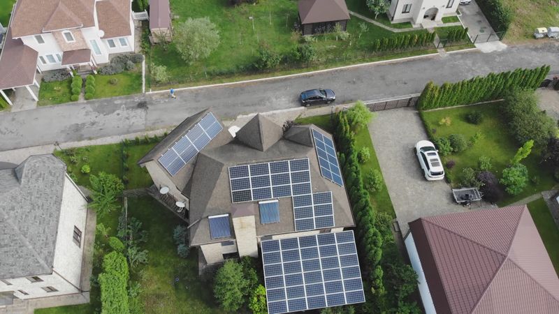 Aerial view of a house with rooftop solar panels