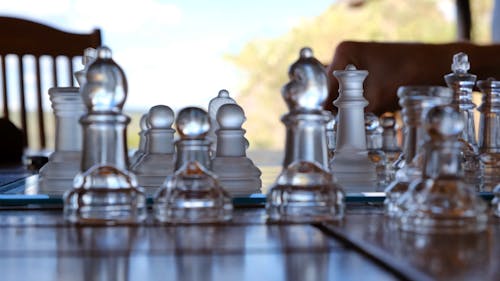 A Chess Game Pieces Made Of Glass