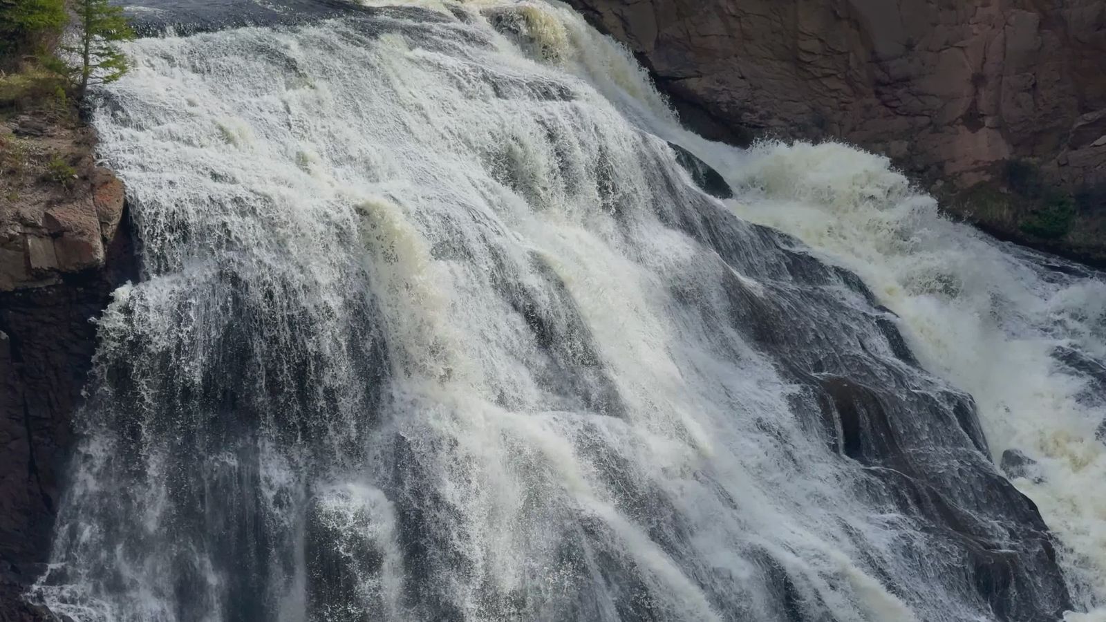 A waterfall is shown in the middle of a forest Free Stock Video Footage ...