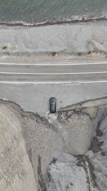 Cliffside Rd Top View Aerial View of Car on Coastal Cliffside Road Free Stock Video Footage ...