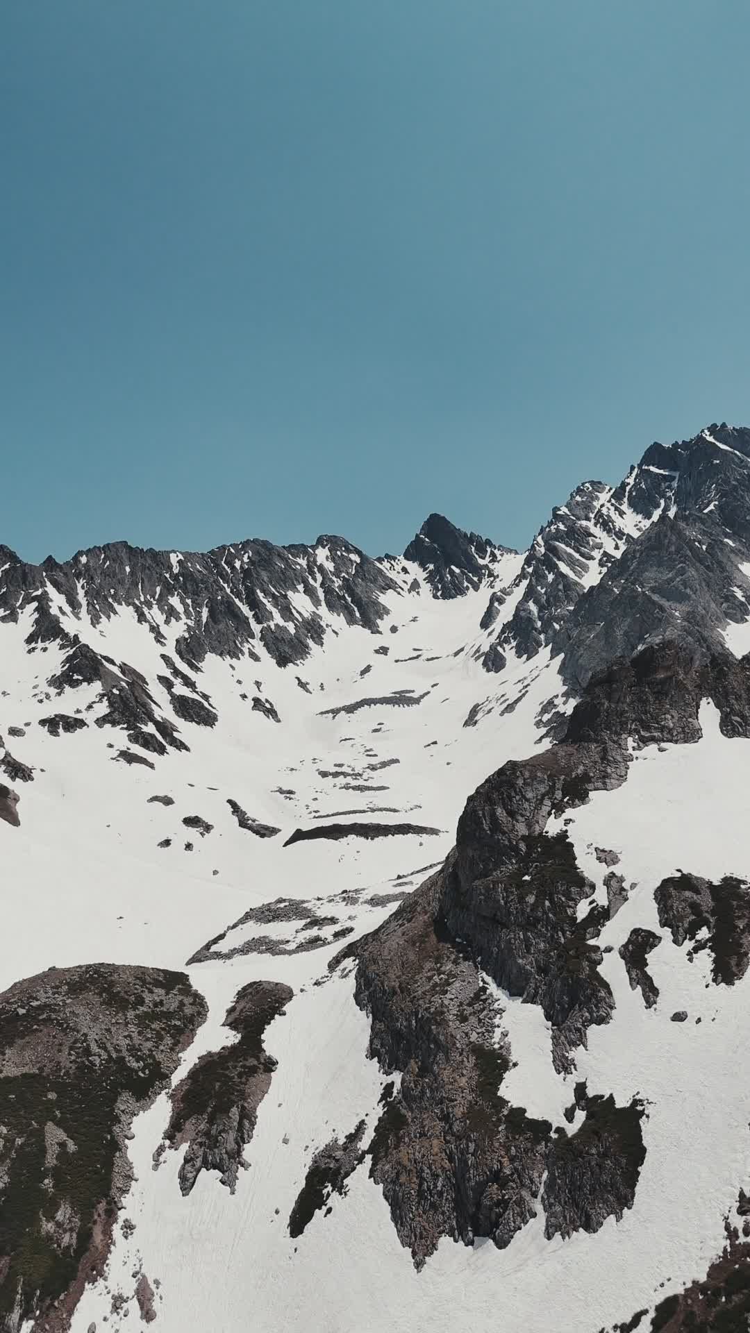 Aerial View of Snow-Covered Mountain Peaks Free Stock Video Footage ...