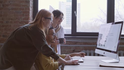 People Looking At A Computer