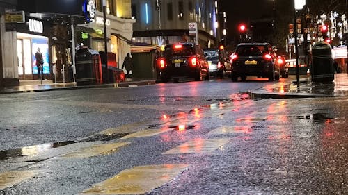 Light Traffic In London Street On A Rainy Night
