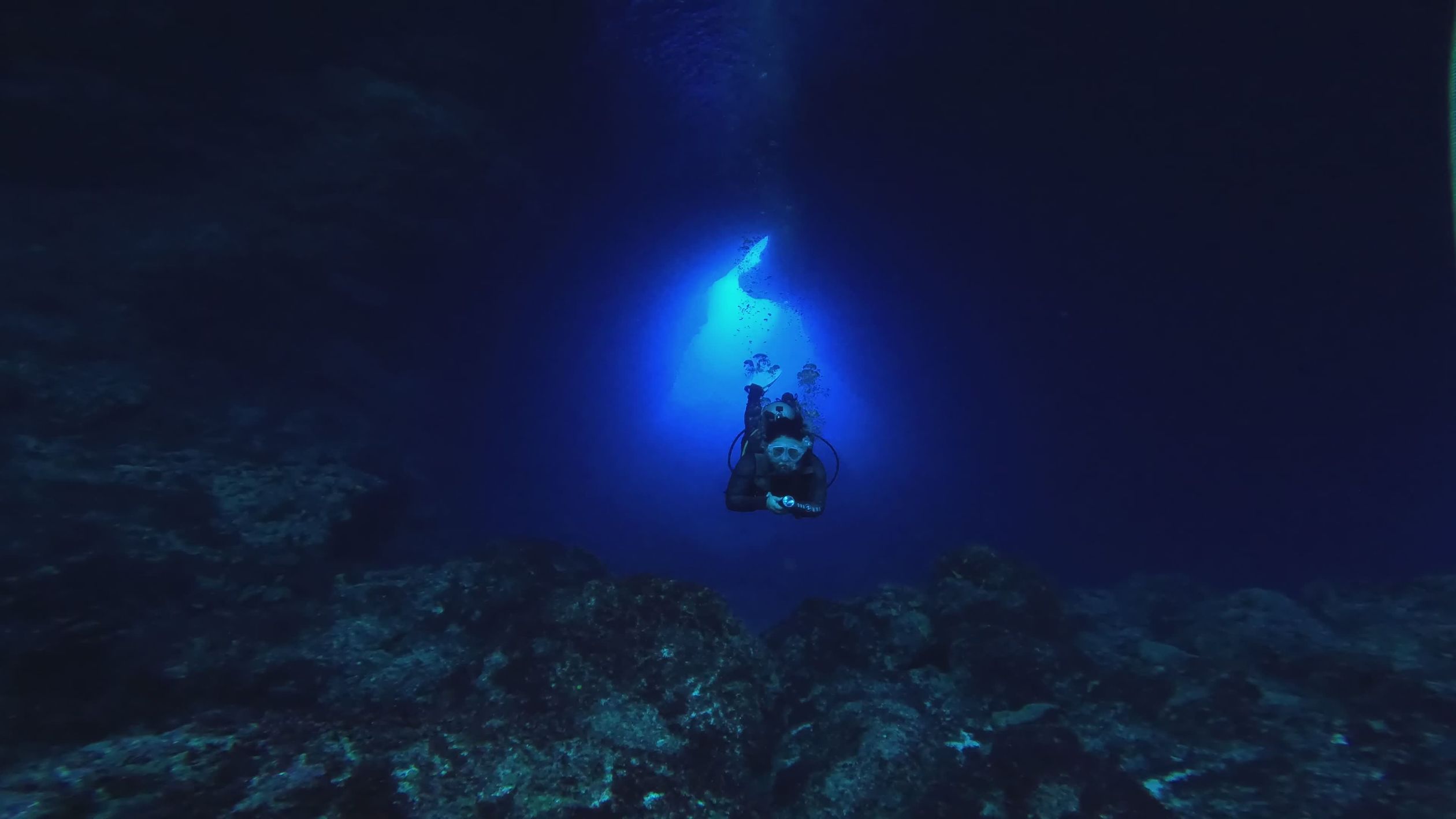 Diver Exploring Underwater Cave in Deep Ocean Free Stock Video Footage ...