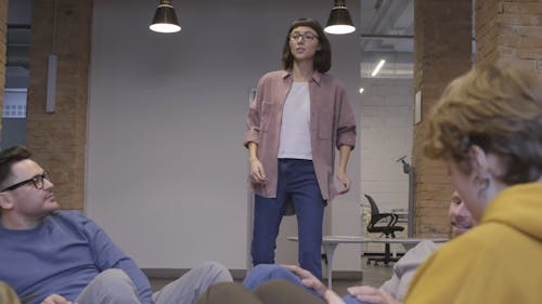 A Group Of People Cheer In Happiness Over A Good News A Woman Breaks