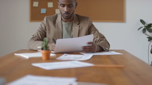 Man Signing Papers