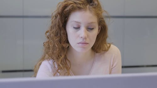 A Woman Fully Concentrated On Her Work