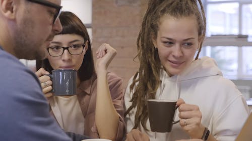 Group Of People Having A Small Meeting Together