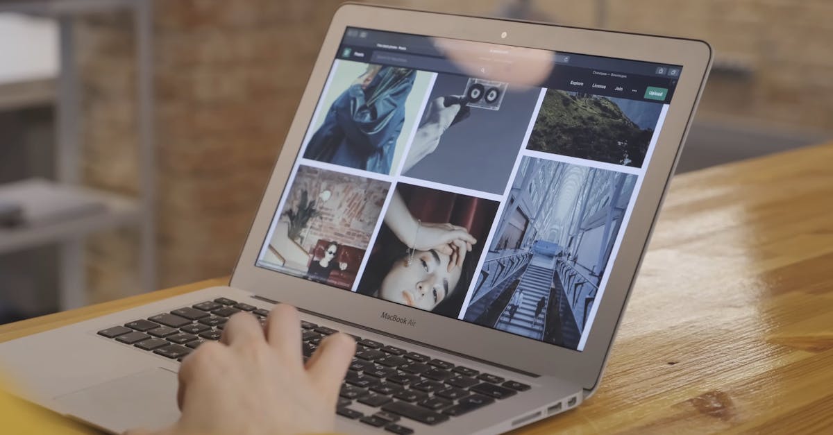 Person Working And Looking At Pictures On A Laptop Free Stock Video ...