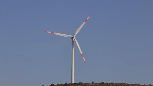 A Windmill On Top Of A Mountain