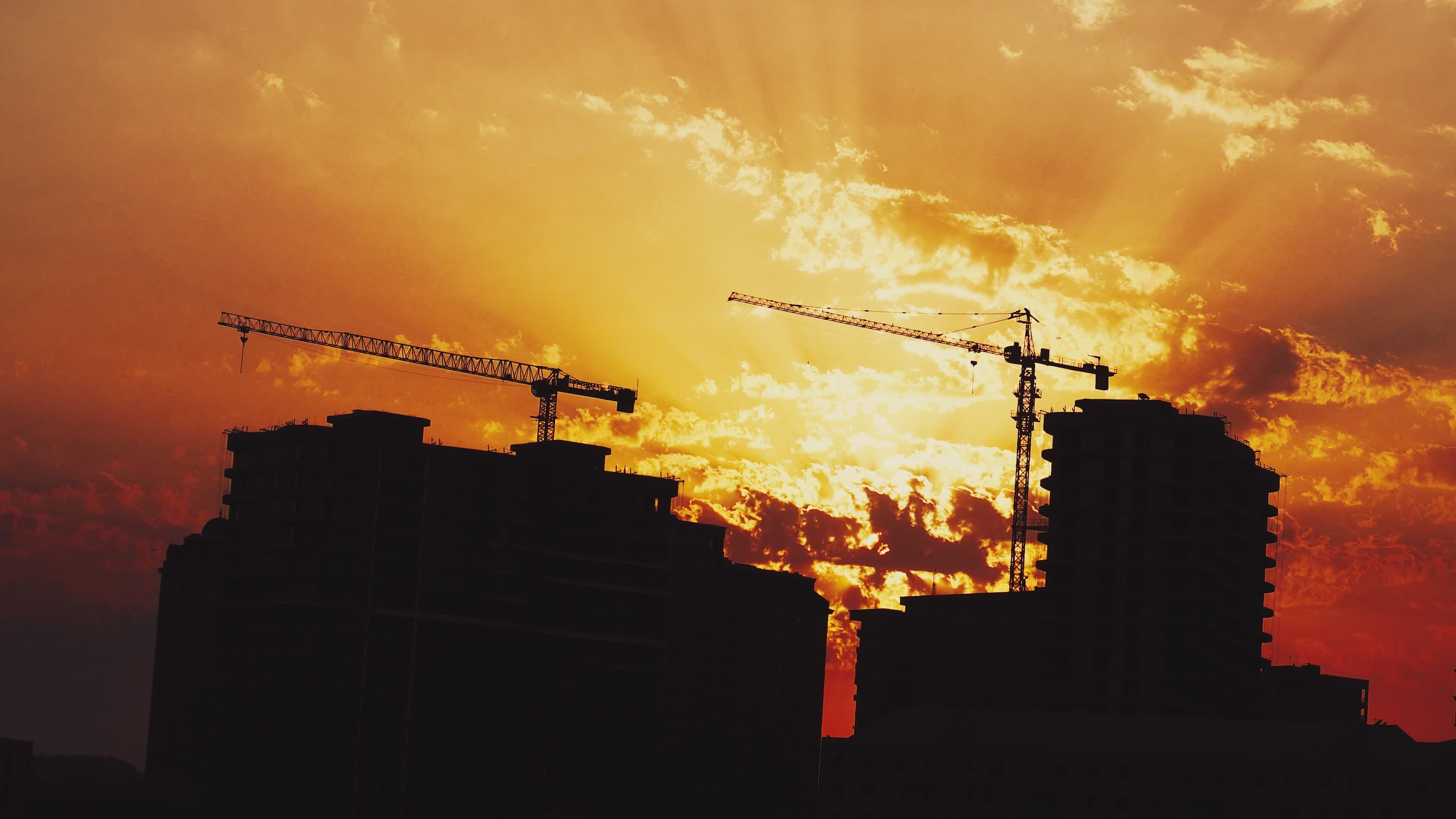 Sunset Urban Skyline with Construction Cranes Free Stock Video Footage ...