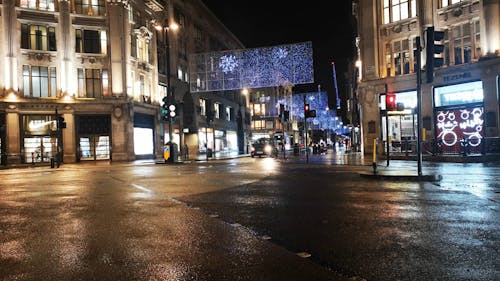 A Street In Central London With Christmas Lights For Attraction And Decoration