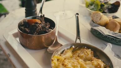 delicious french cuisine on a rustic outdoor table