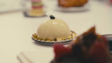 elegant dessert dome on display at patisserie