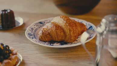 delicious breakfast pastries on wooden table