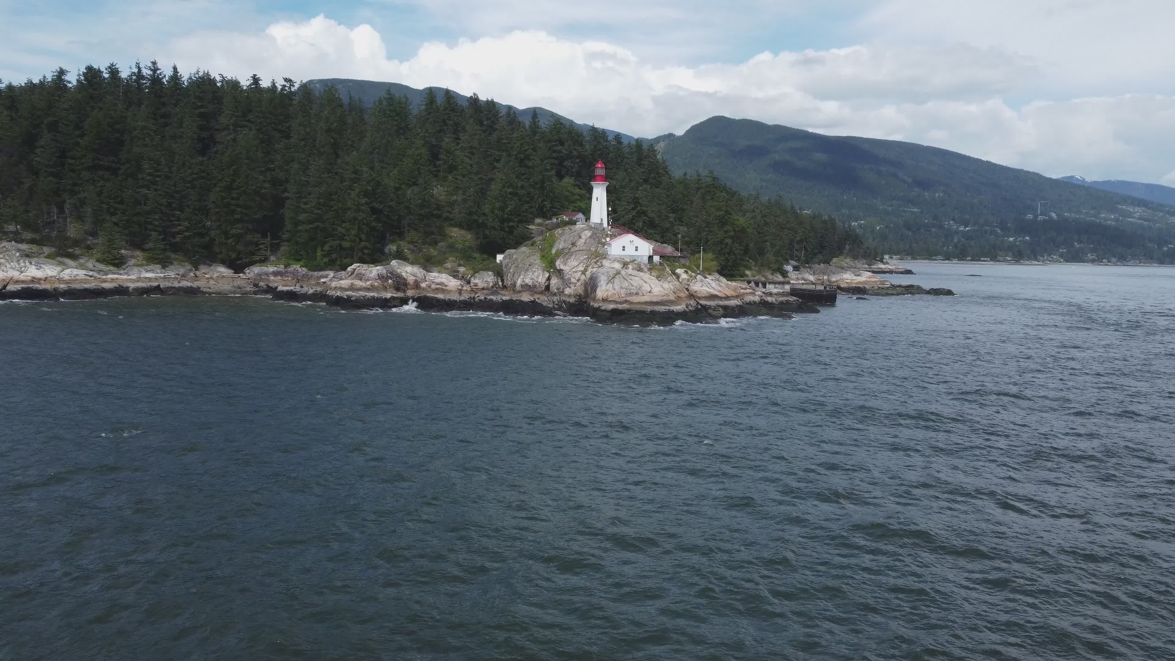 aerial view of lighthouse on rocky coastline 32746556 — free pexels stock footage