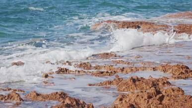 crashing waves on rocky coastline