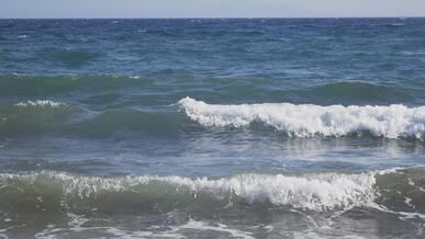 dynamic ocean waves breaking on shore