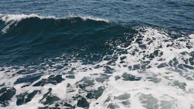 dramatic ocean waves crashing in open sea