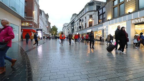 People Walking On The Street Of A Shopping Center