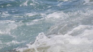 dramatic ocean waves splashing on a rocky coastline