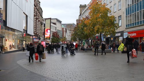 People Busy Walking On A Shopping Center 