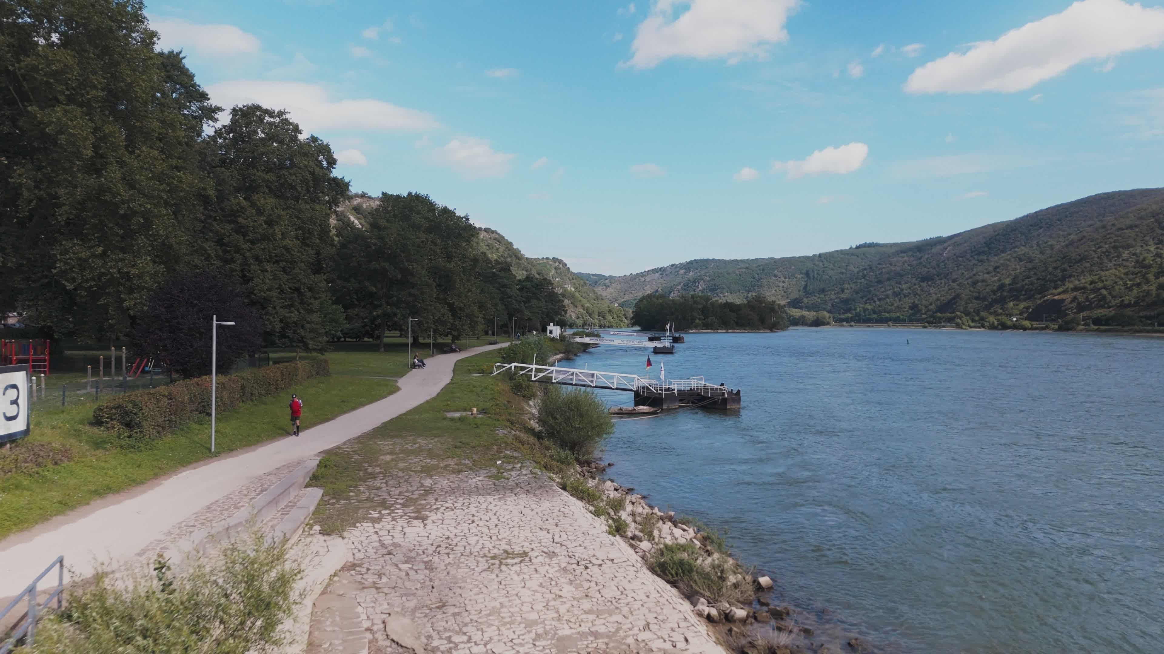 Scenic Drone View of Riverside Jetty and Pathway Free Stock Video ...