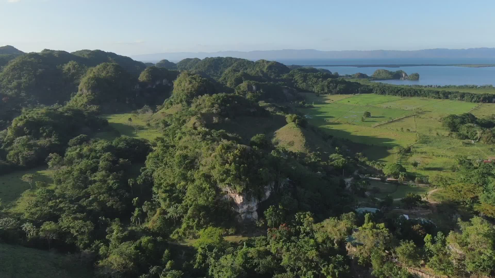 Serene Aerial View of Lush Green Hills and Lake Free Stock Video ...