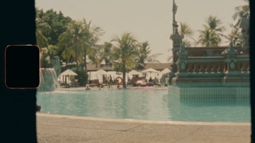 An Old Video Of People Swimming In The Pool Of A Resort