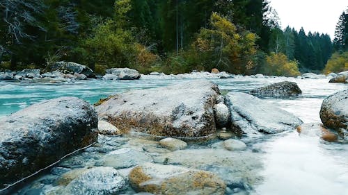 Boulders Of Rocks Formation On The Riverside Of A River In The Forest